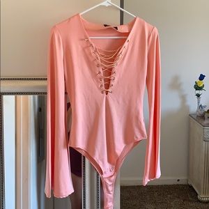 Carol colored bodysuit. Never been worn